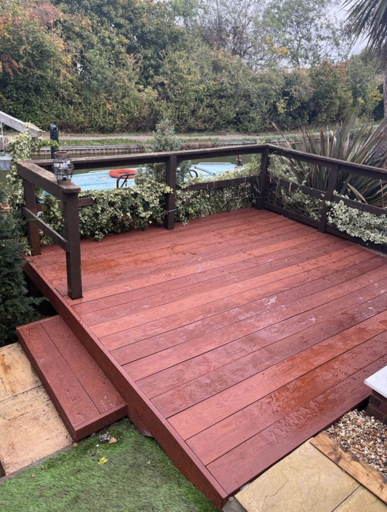 Wooden deck overlooking canal and greenery