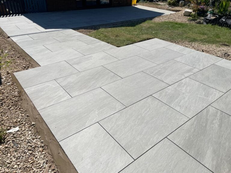 Newly installed grey patio slabs.